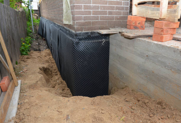 Happy homeowners after waterproofing job in New Albany